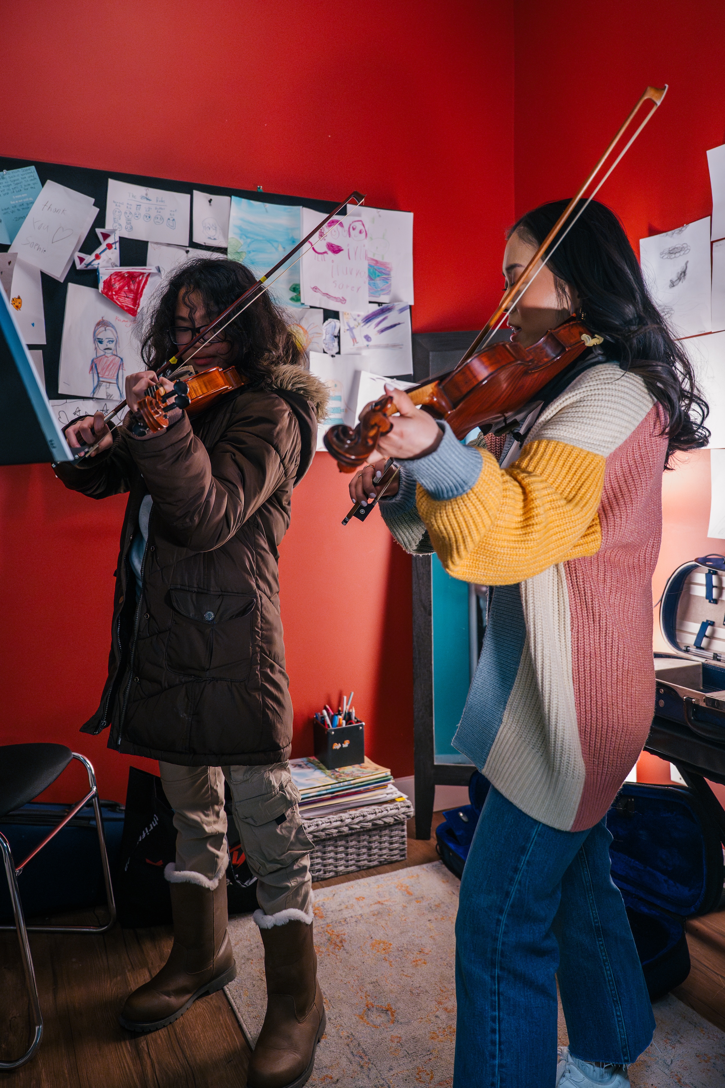 Two violinists playing together at Resonate Music School